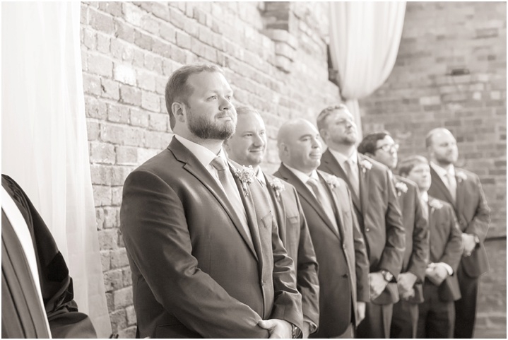groom standing at ceremony with groomsmen