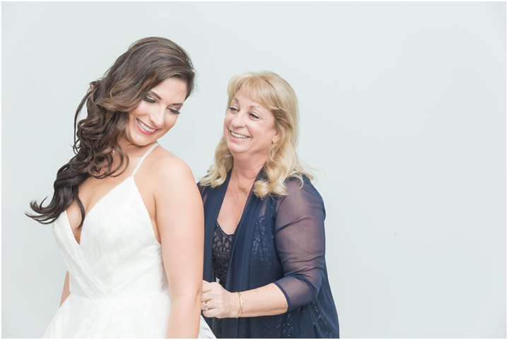 bride getting ready with her mom on wedding day in Charlotte NC