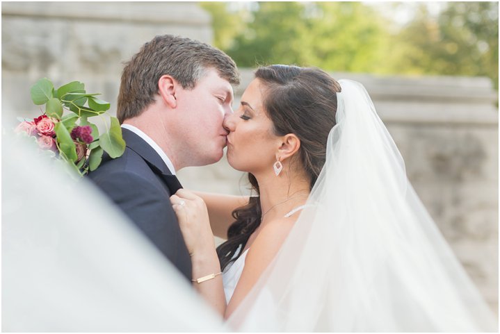 bride and groom share a kiss on their wedding day Charlotte NC