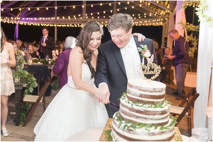 bride and groom cutting naked cake at wedding reception in Charlotte NC at Carmel Country Club