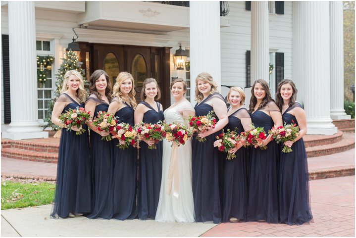 bride with bridesmaids at Ryan Nicholas Inn in Greenville SC; gold and navy inspired wedding