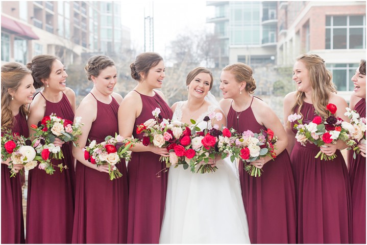 bride with bridesmaids in downtown Greenville SC with floral bouquets