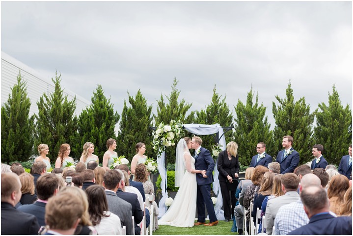 First kiss wedding ceremony on rooftop Avenue downtown Greenville