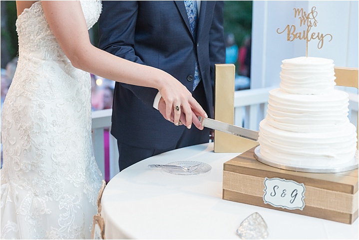 family heirloom ring bride groom cake cutting ryan and alyssa photography
