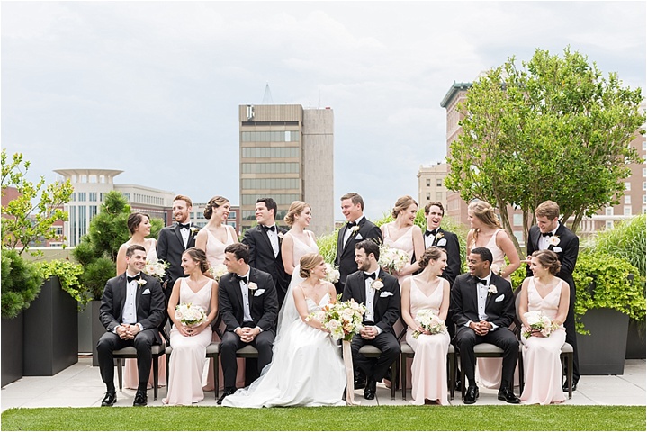 blush and blackie wedding party on rooftop at Avenue downtown Greenville SC