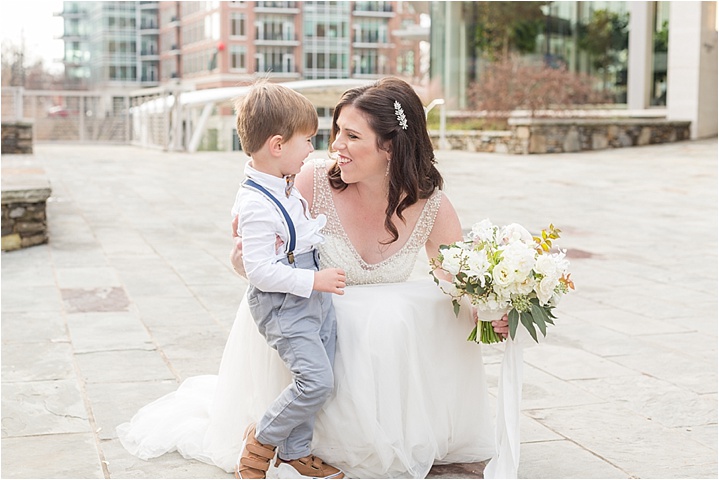 bride and ring bearer on wedding day downtown Greenville SC