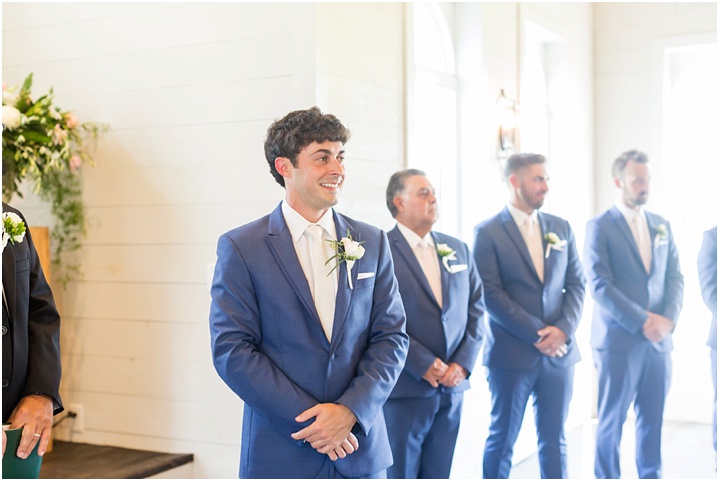 joyful groom reaction to bride wedding ceremony