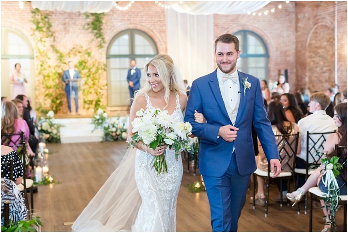 joyful bride and groom recessional Summer Downtown Wedding at The L