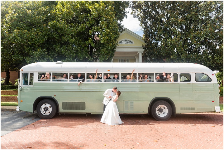 vintage getaway bus with bridal party