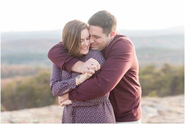 couple smiling at bald rock engagement session
