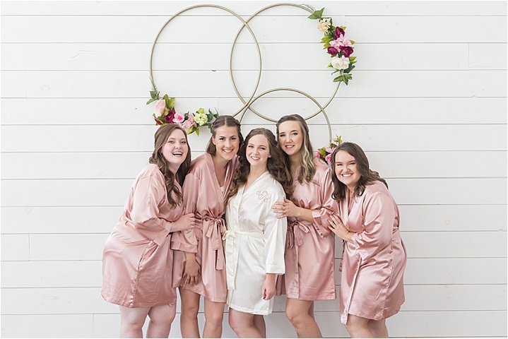 pink bridesmaids robes morning of spring wedding